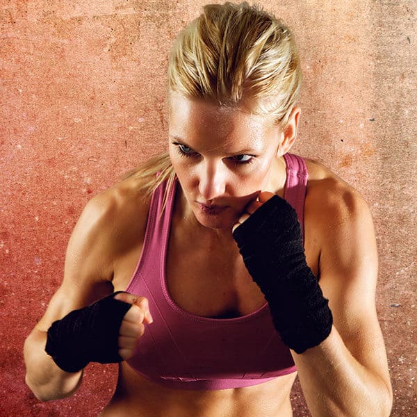 Mixed Martial Arts Lessons for Adults in Stafford VA - Lady Kickboxing Focused Background