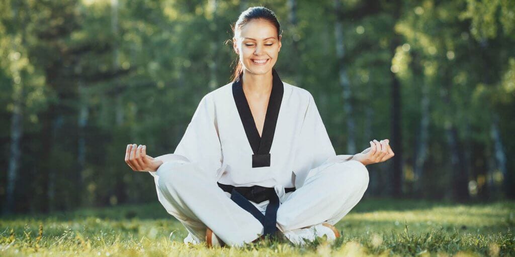 Martial Arts Lessons for Adults in Stafford VA - Happy Woman Meditated Sitting Background